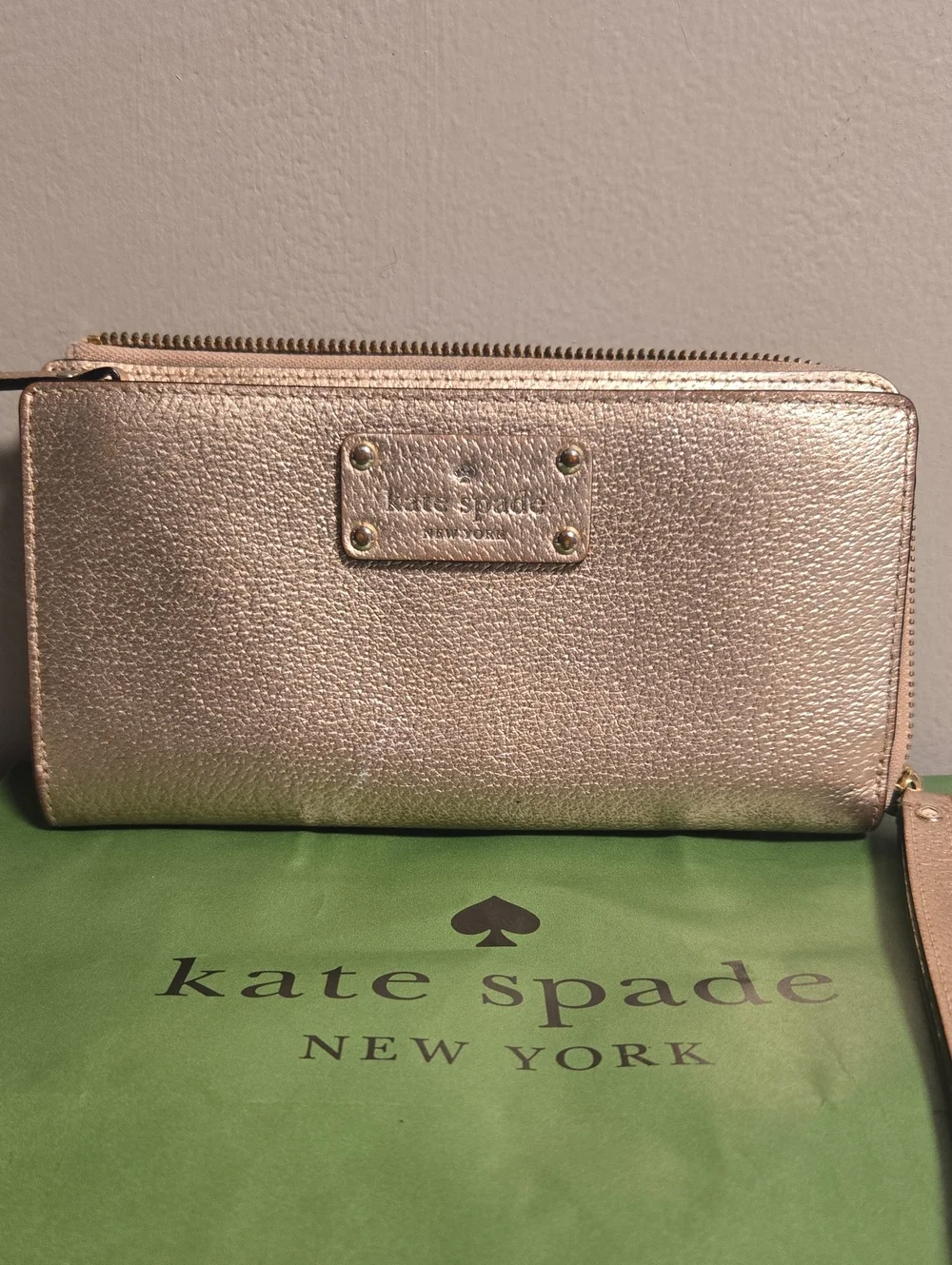 Kate Spade metallic gold zip-around wristlet